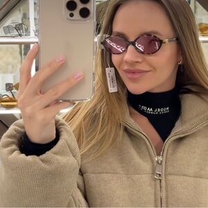 Miu Miu Oval Sunglasses